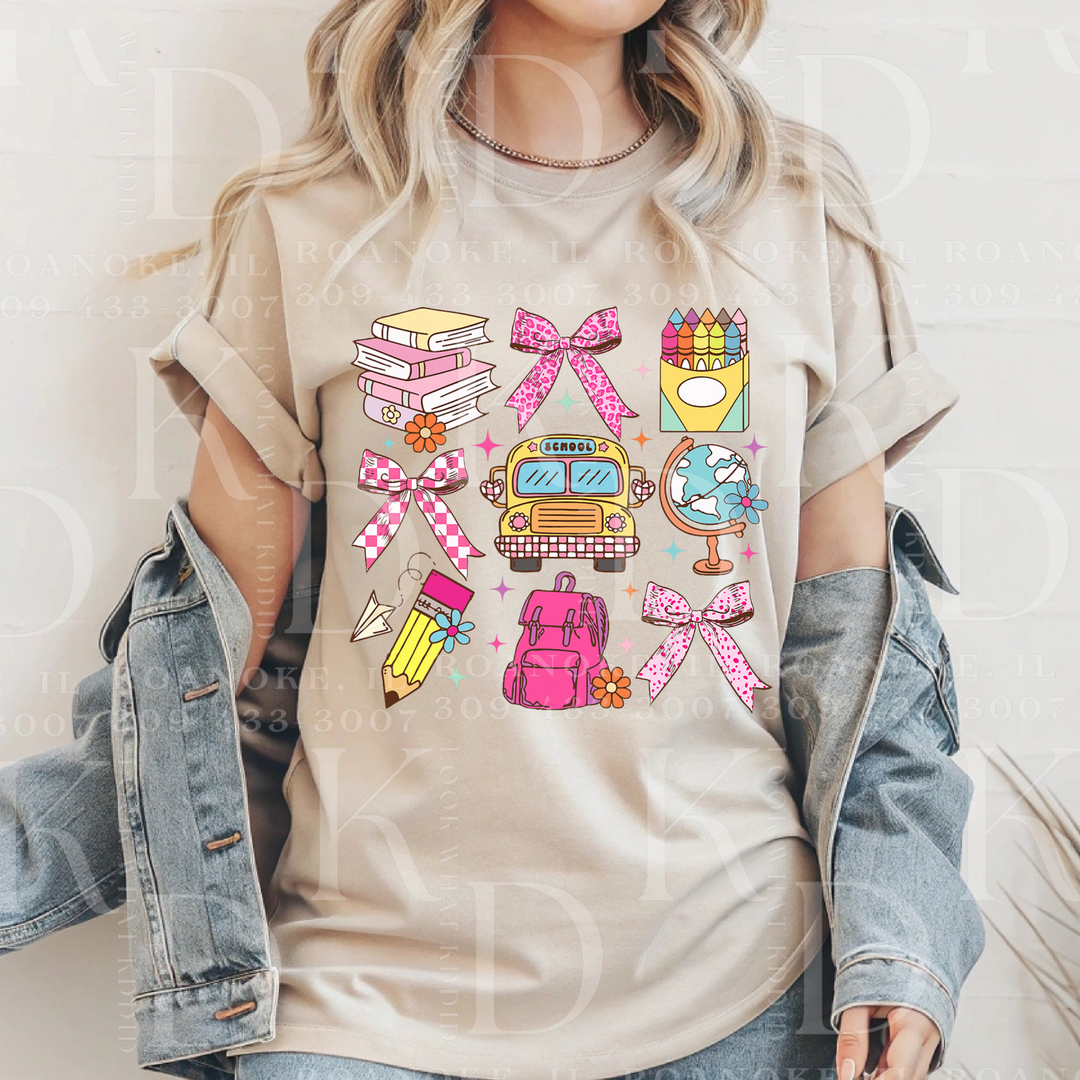 shirt that has school supplies with pink elements